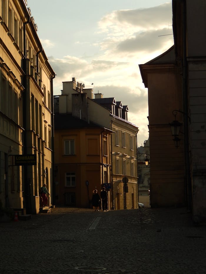 Beautiful sunset over a European street with historic architecture.